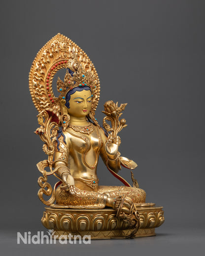 Side view Serene Green Tara Statue seated in royal ease posture holding Utpala flower