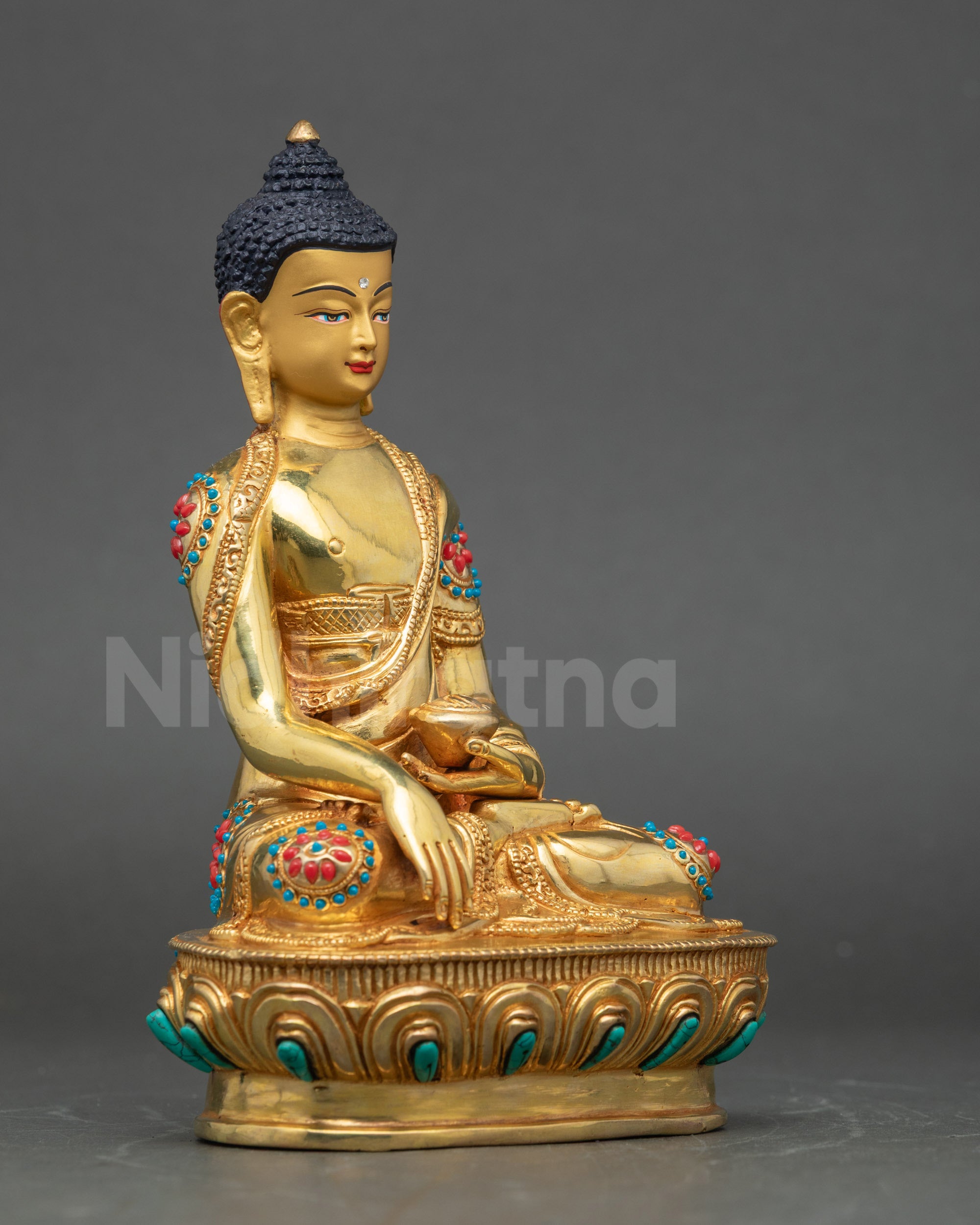 Side view Shakyamuni Buddha sculpture, intricate robes and lotus seat, Nepalese art
