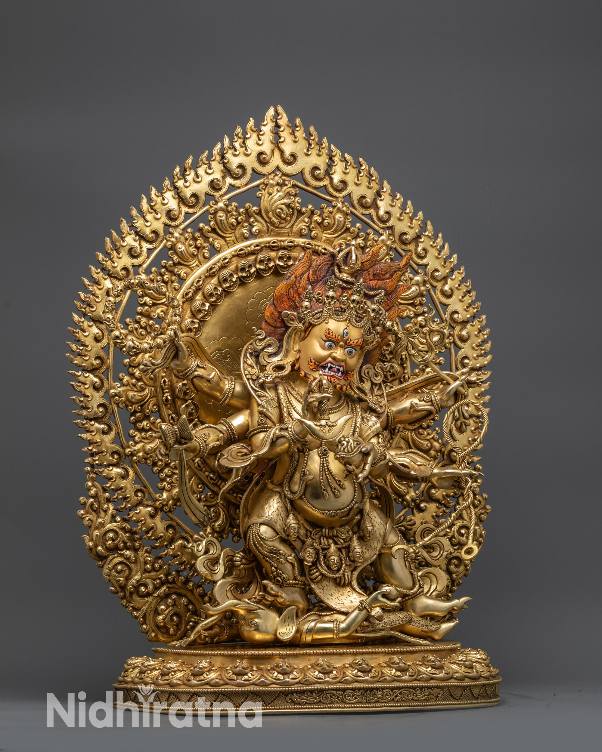 Side view Six-Armed Mahakala statue with five-skull crown and tiger skin garment