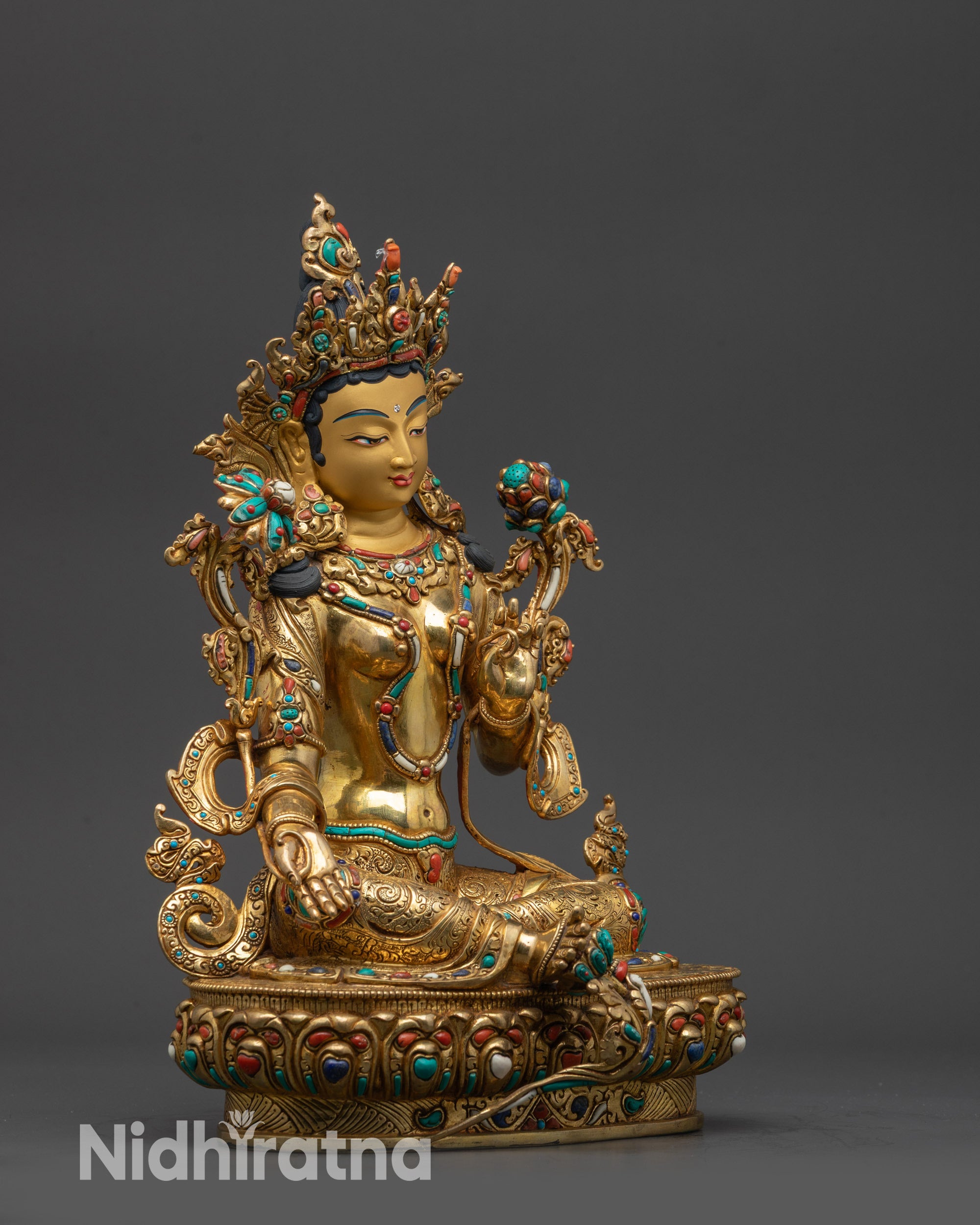 Side view Supreme Mother Green Tara Statue highlighting flowing robes and double ease posture