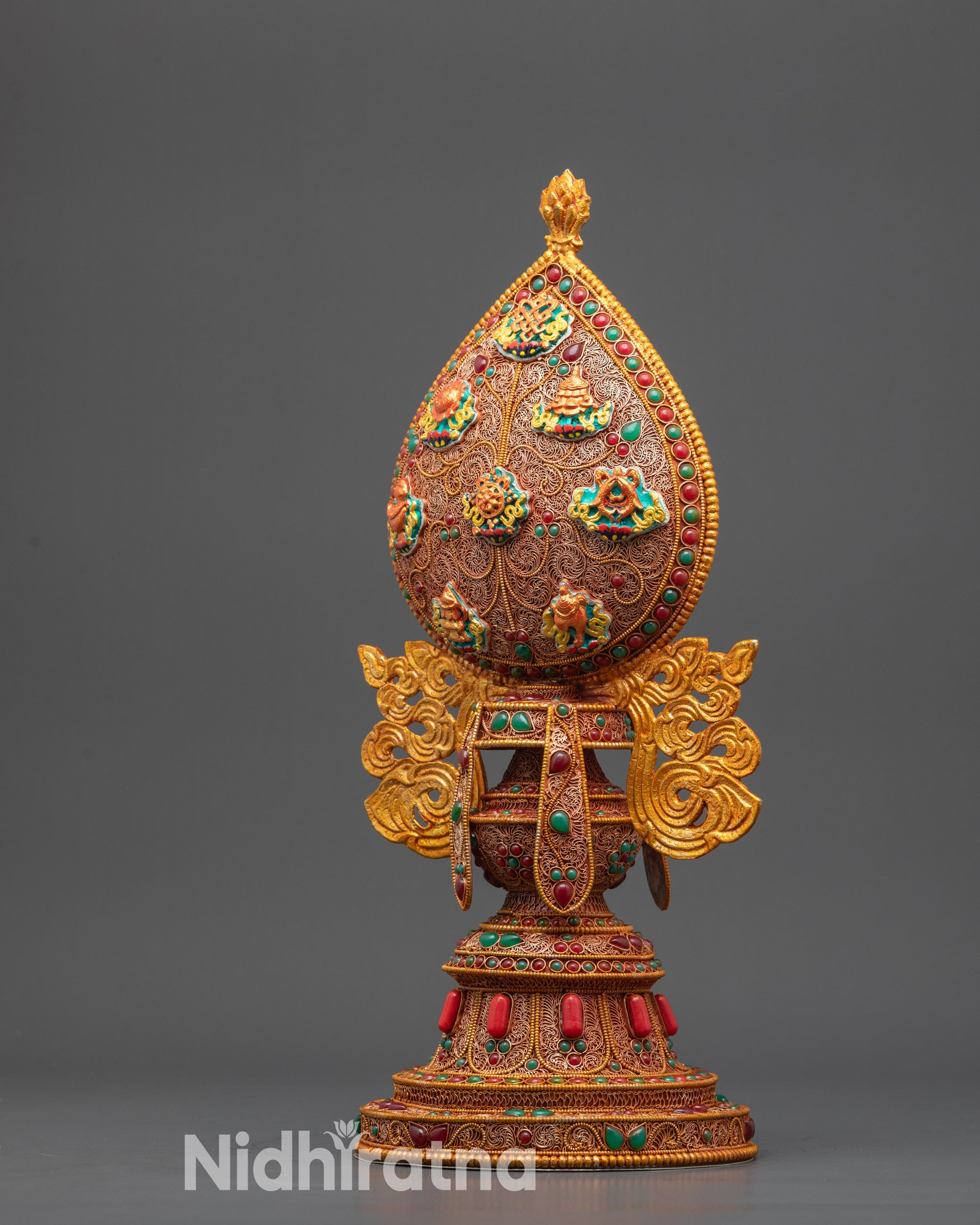 Side view Tibetan Ashtamangala highlighting copper base and symbolic Auspicious Symbols

