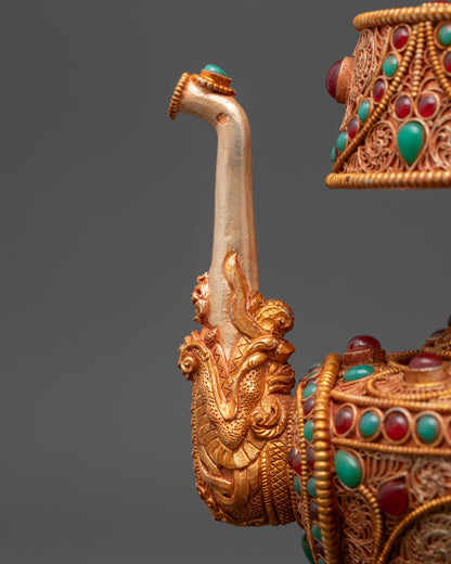Side view Tibetan Bhumba highlighting domed lid and intricate gold-plated patterns
