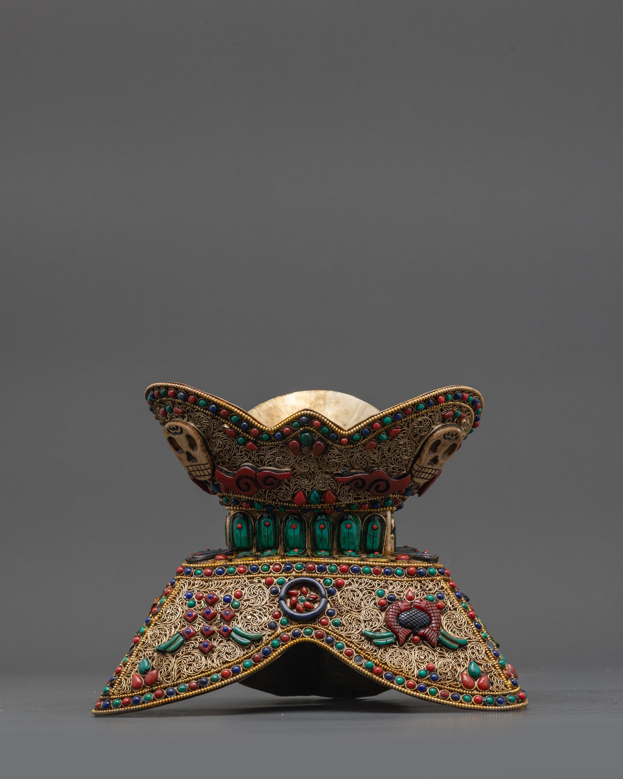 Side view Tibetan Kapala showing dual-section design and Astamangala symbols
