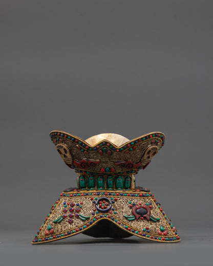 Side view Tibetan Kapala showing dual-section design and Astamangala symbols
