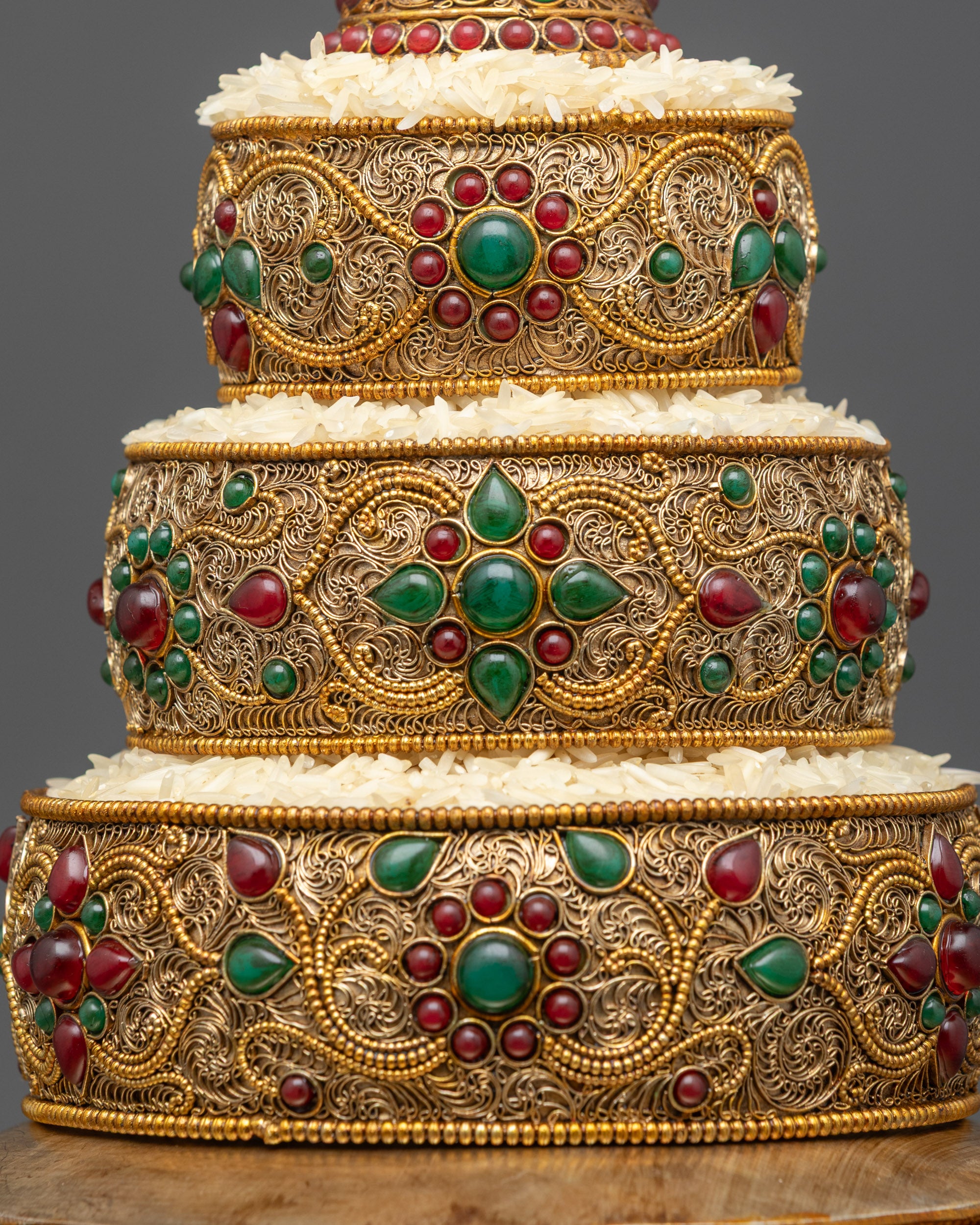 Side view Tibetan Mandala highlighting delicate filigree and semi-precious stones
