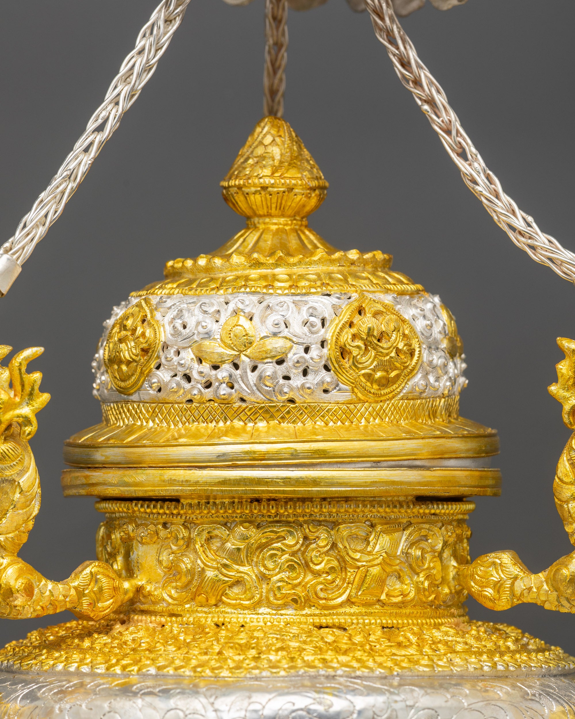 Side view Tibetan Sangbur twin incense burners with curved vessels and braided strands