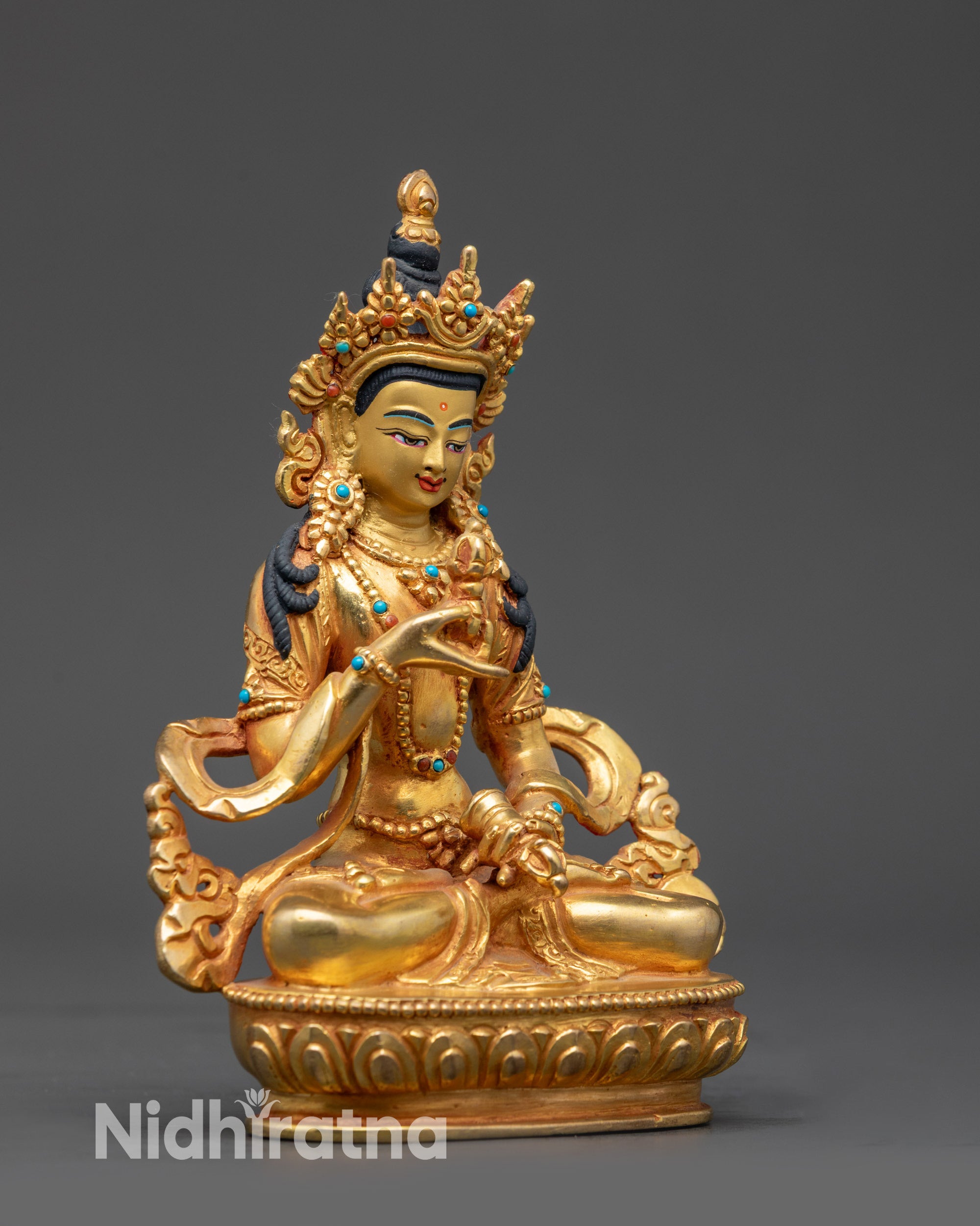 Side view Tibetan Vajrasattva holding dorje and ghanta in meditation posture
