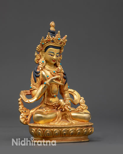 Side view Tibetan Vajrasattva holding dorje and ghanta in meditation posture
