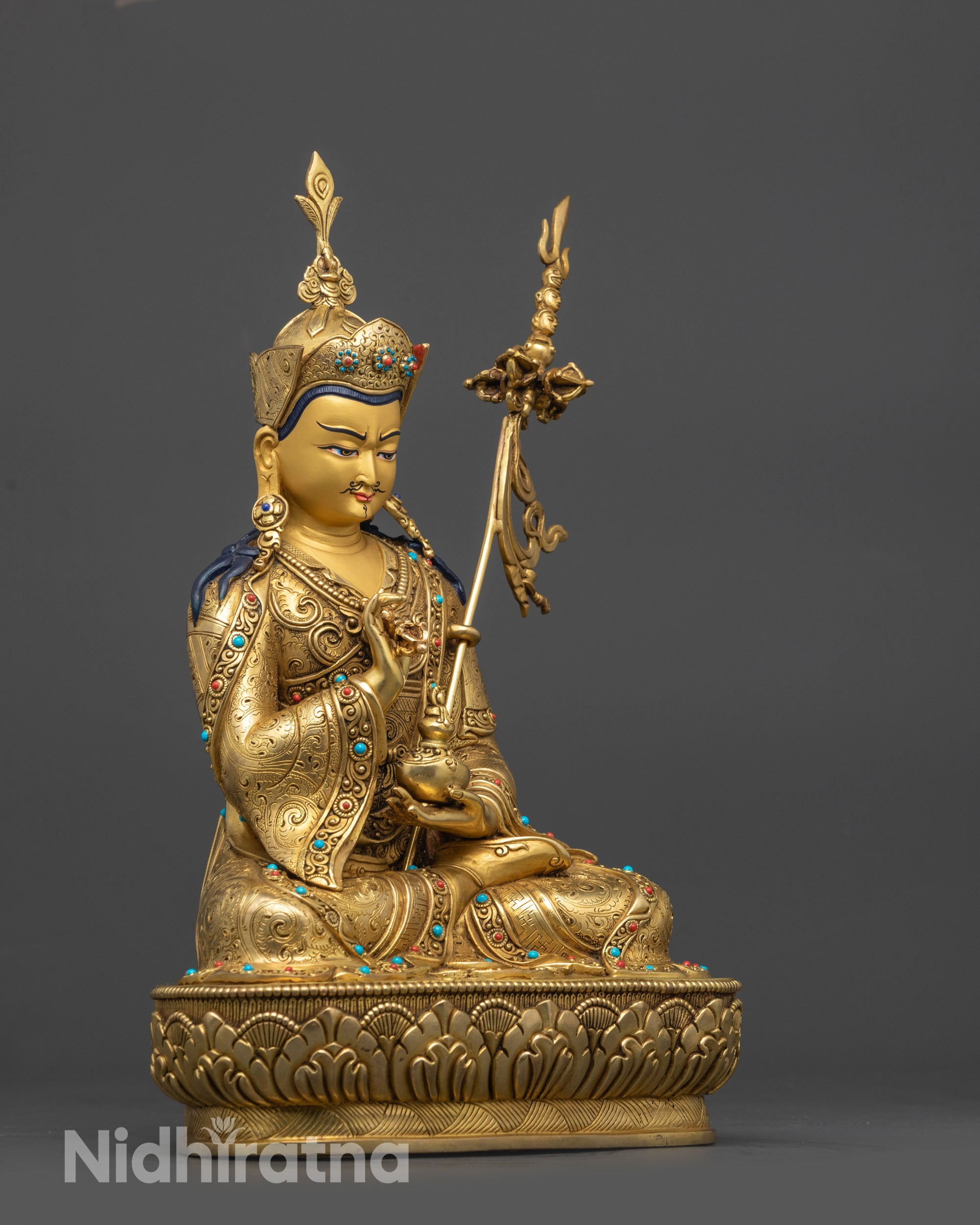 Side view Tsokye Dorje Statue holding dorje, skullcup, and khatvanga staff
