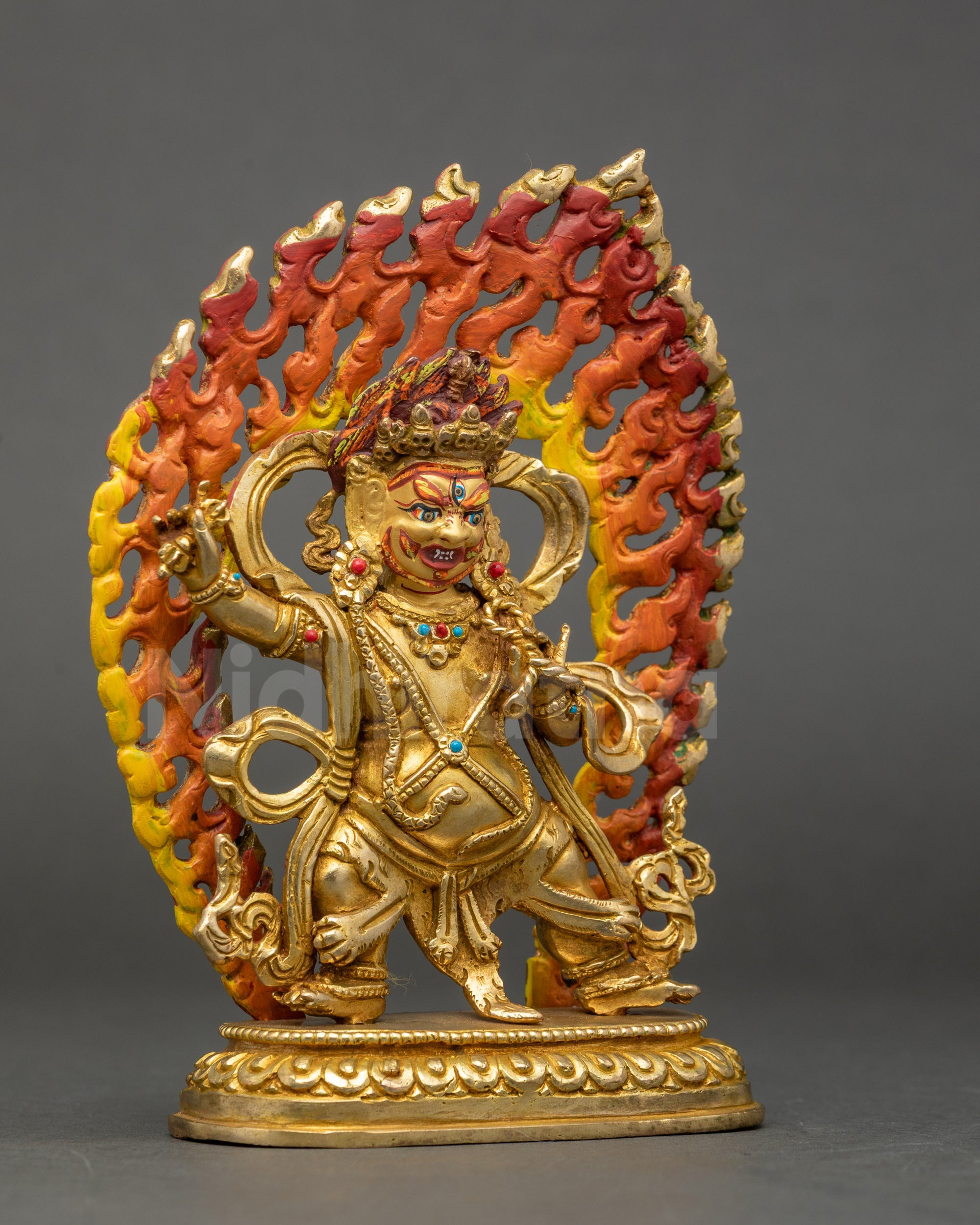 Side view Vajrapani statue holding vajra and lasso on lotus throne