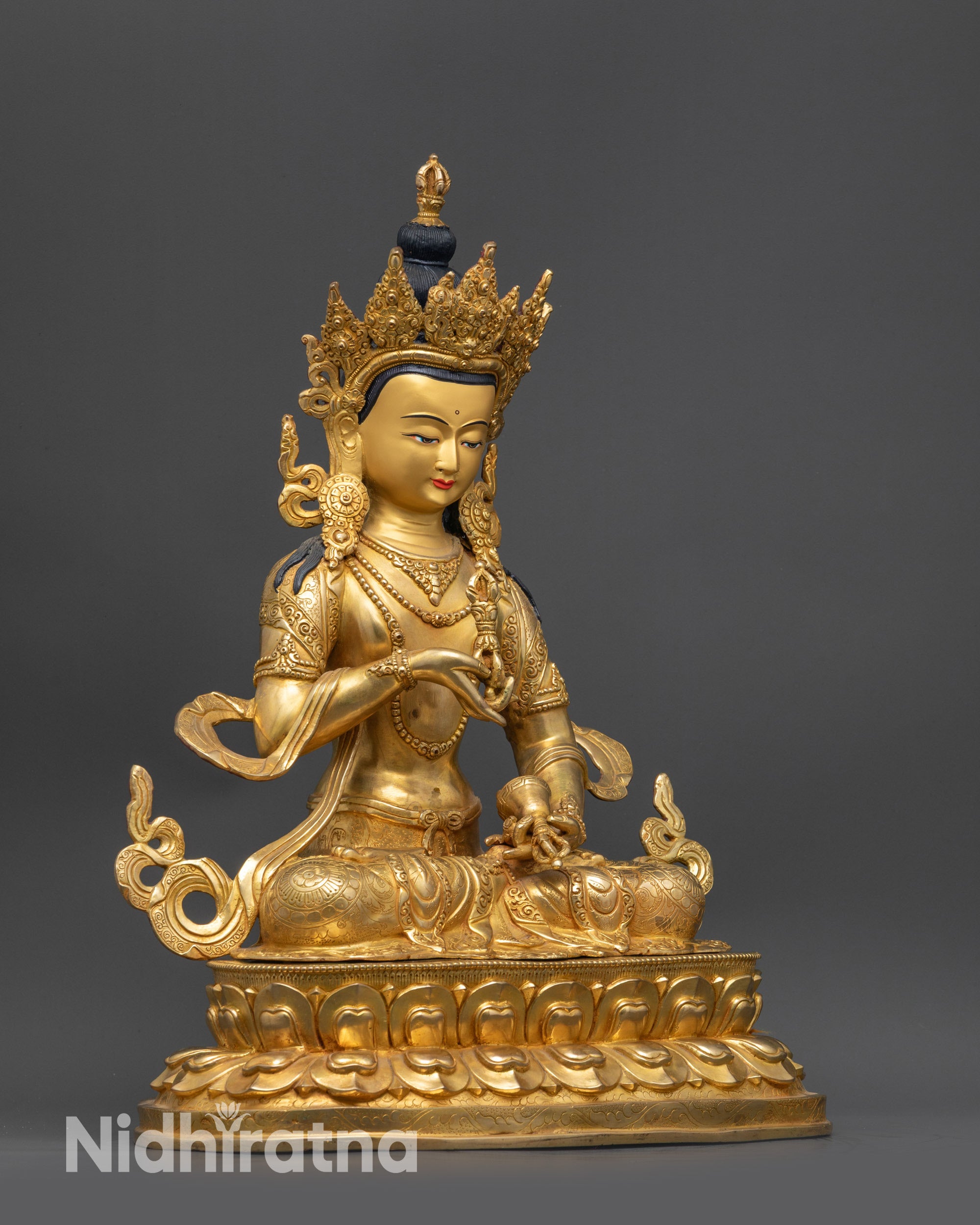 Side view Vajrasattva Dorje Sempa statue holding Dorje and Bell in meditative posture