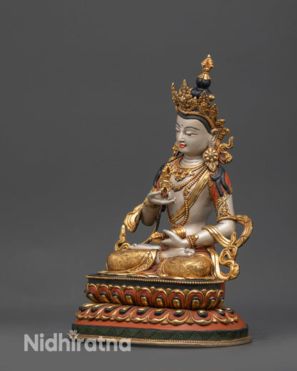Side view Vajrasattva sculpture displaying swirling gold-plated robe and ornate lotus seat details