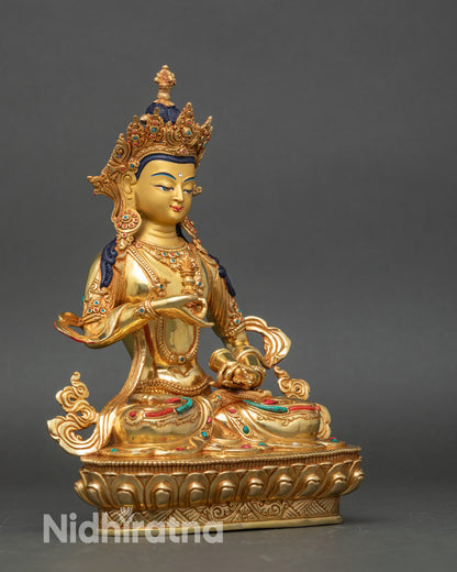 Side view Vajrasattva statue holding vajra and bell lotus base Vajrayana deity