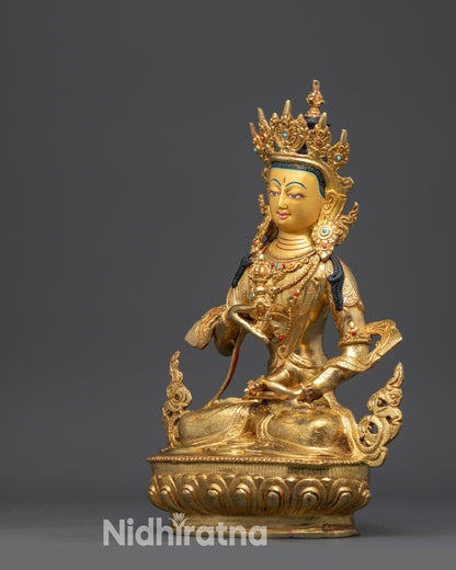 Side view Vajrasattva statue showing flowing robe and intricate lower garment