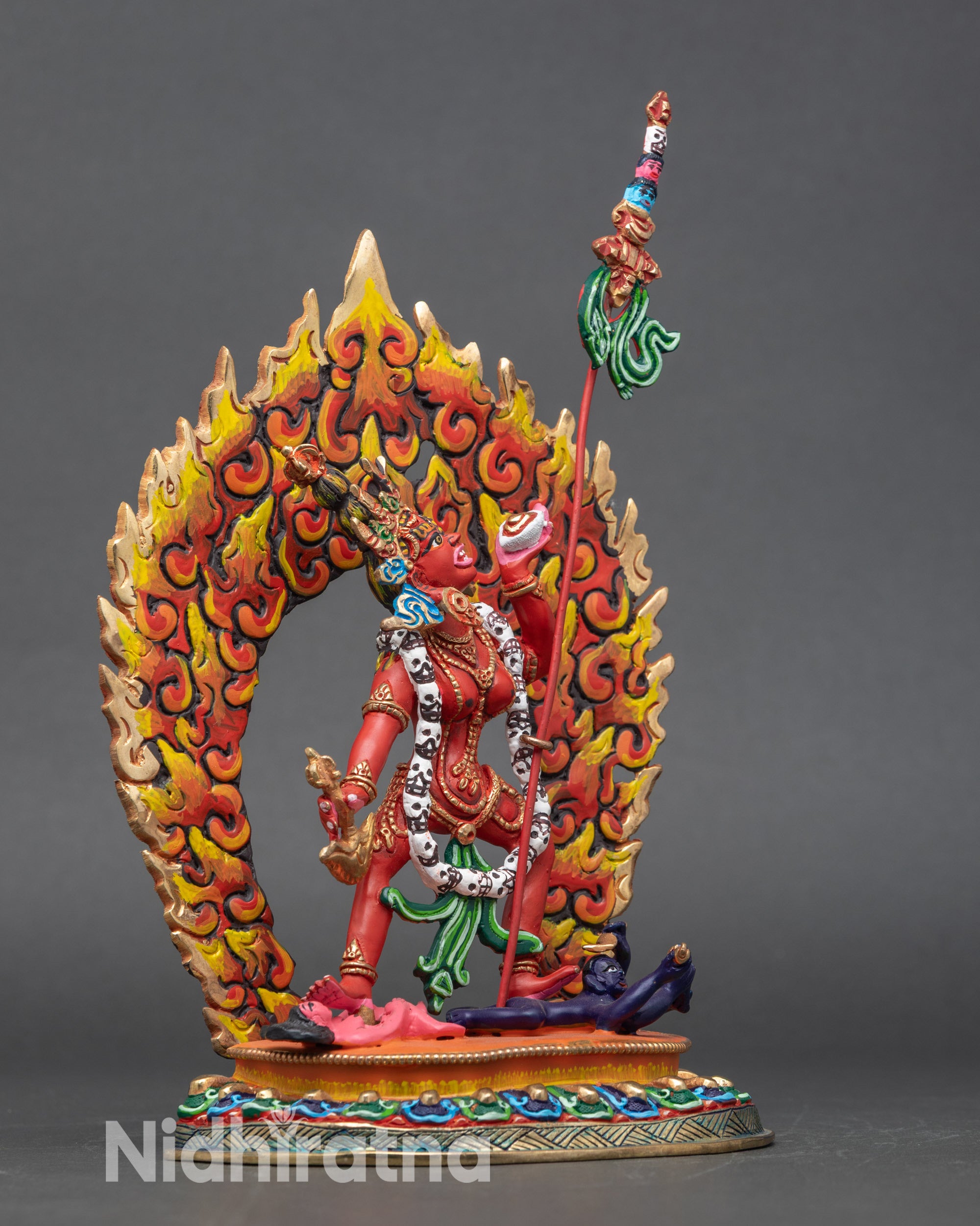 Side view Vajrayogini sculpture holding kartika knife skull cup with khatvanga