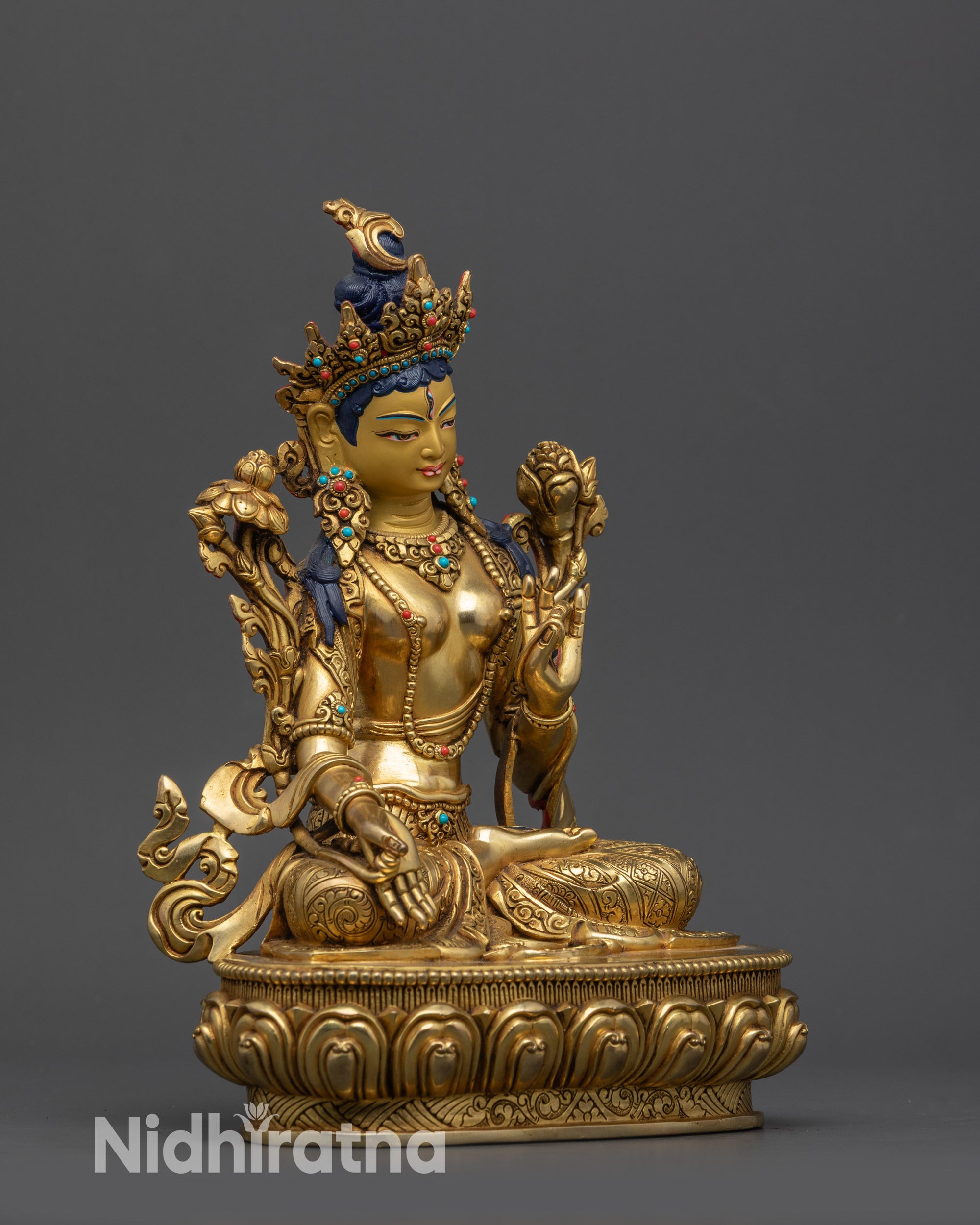 Side view White Tara holding utpala flower with Varada and Vitarka mudras