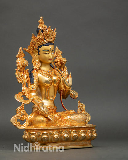 Side view White Tara statue seated on lotus throne with healing and longevity symbolism