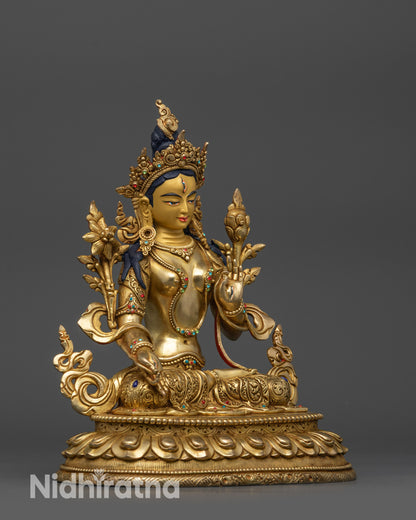 Side view White Tara statue showing flowing robe with semi-precious stones