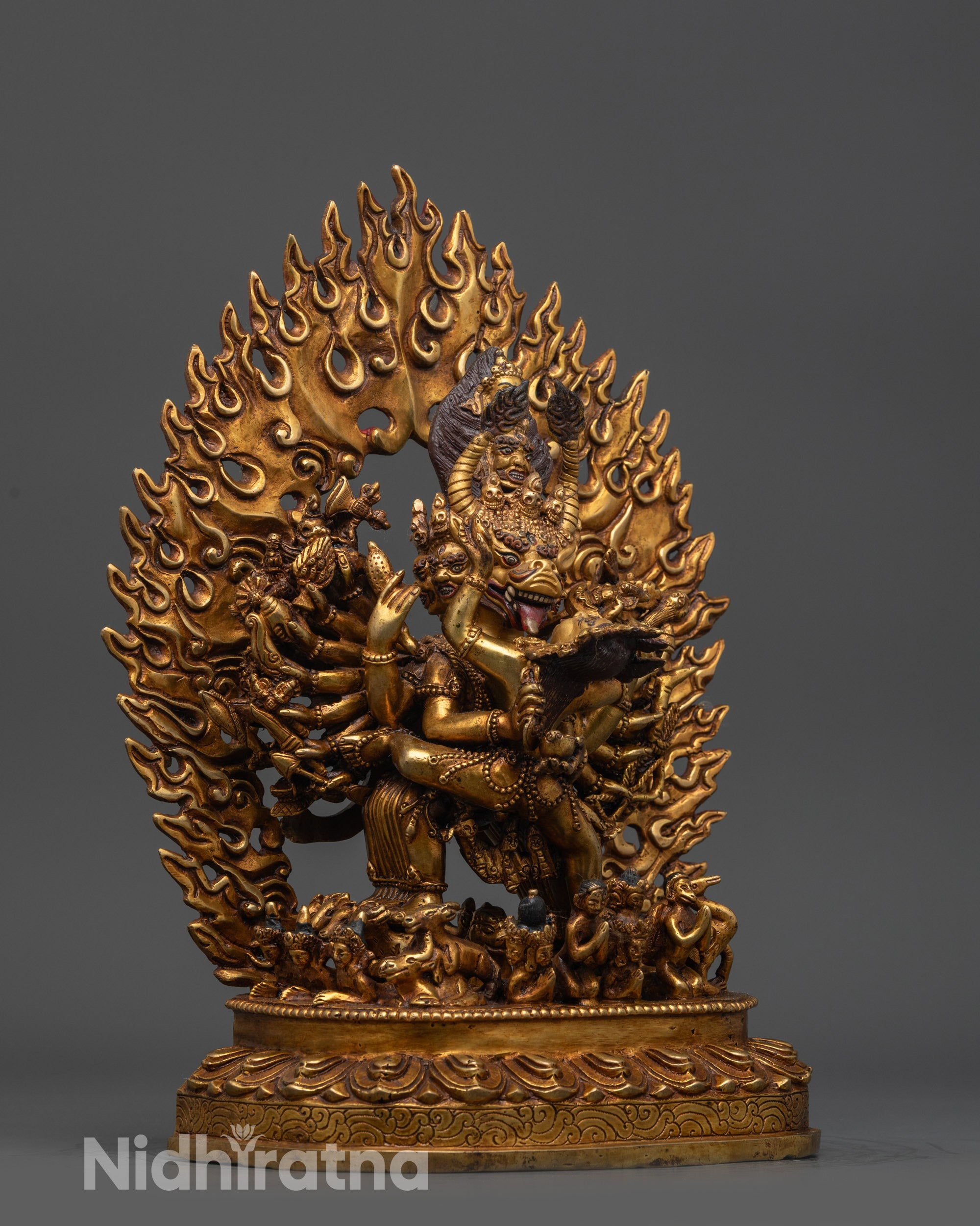 Side view Yamantaka Statue on copper base with fire-gilded body and blazing halo
