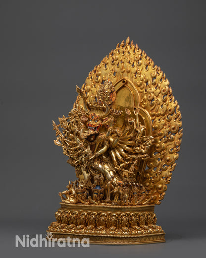 Side view Yamantaka standing in consort atop intricately carved lotus with flaming halo
