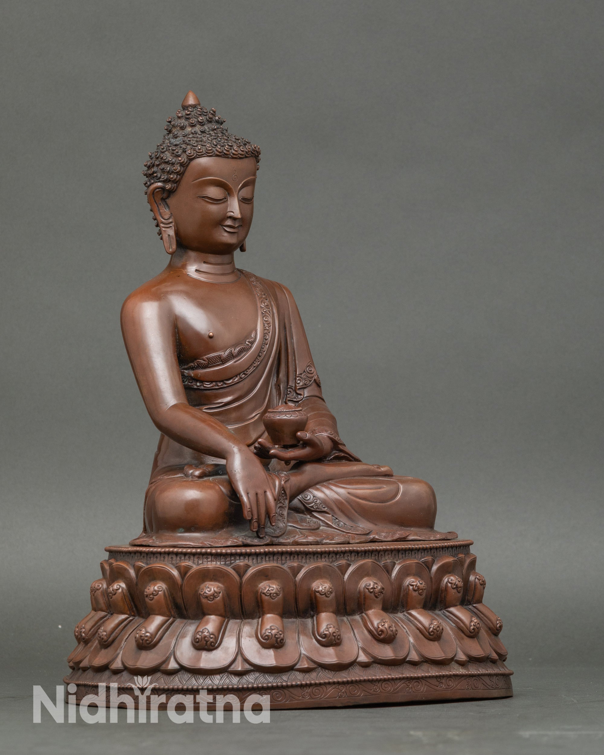 Side view artisan-crafted Shakyamuni Buddha statue holding monk’s bowl sacred décor