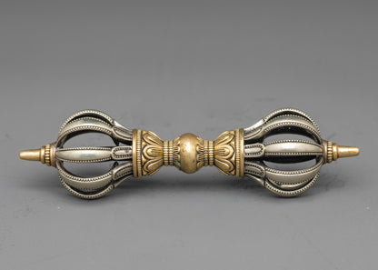 Side view copper Vajra with intricate pattern for sacred Buddhist practice