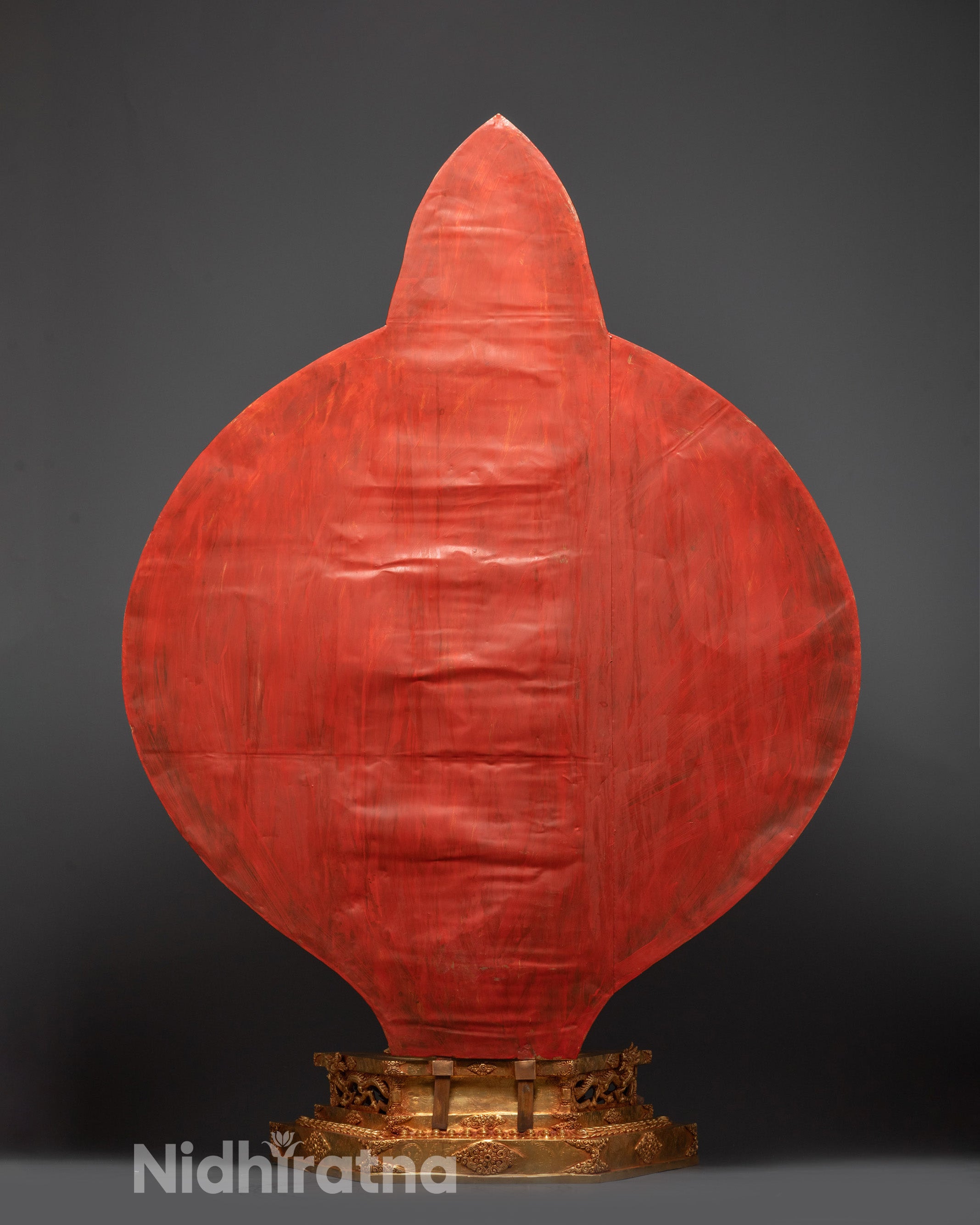 Side view of 1000-Armed Avalokiteshvara statue standing on lotus throne with radiant halo