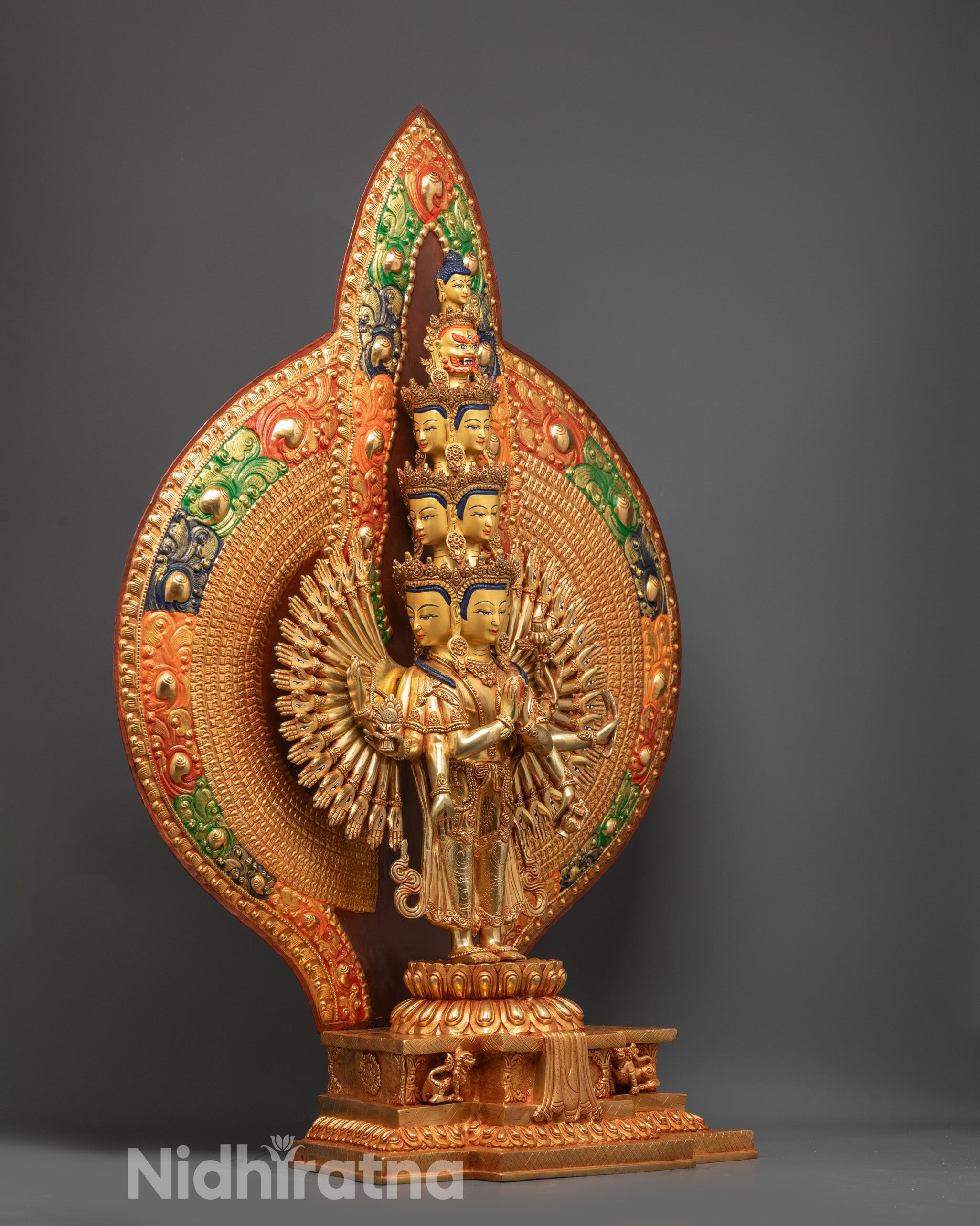 Side view of 1000-Armed Chenrezig Sculpture showing carved patterns and halo details