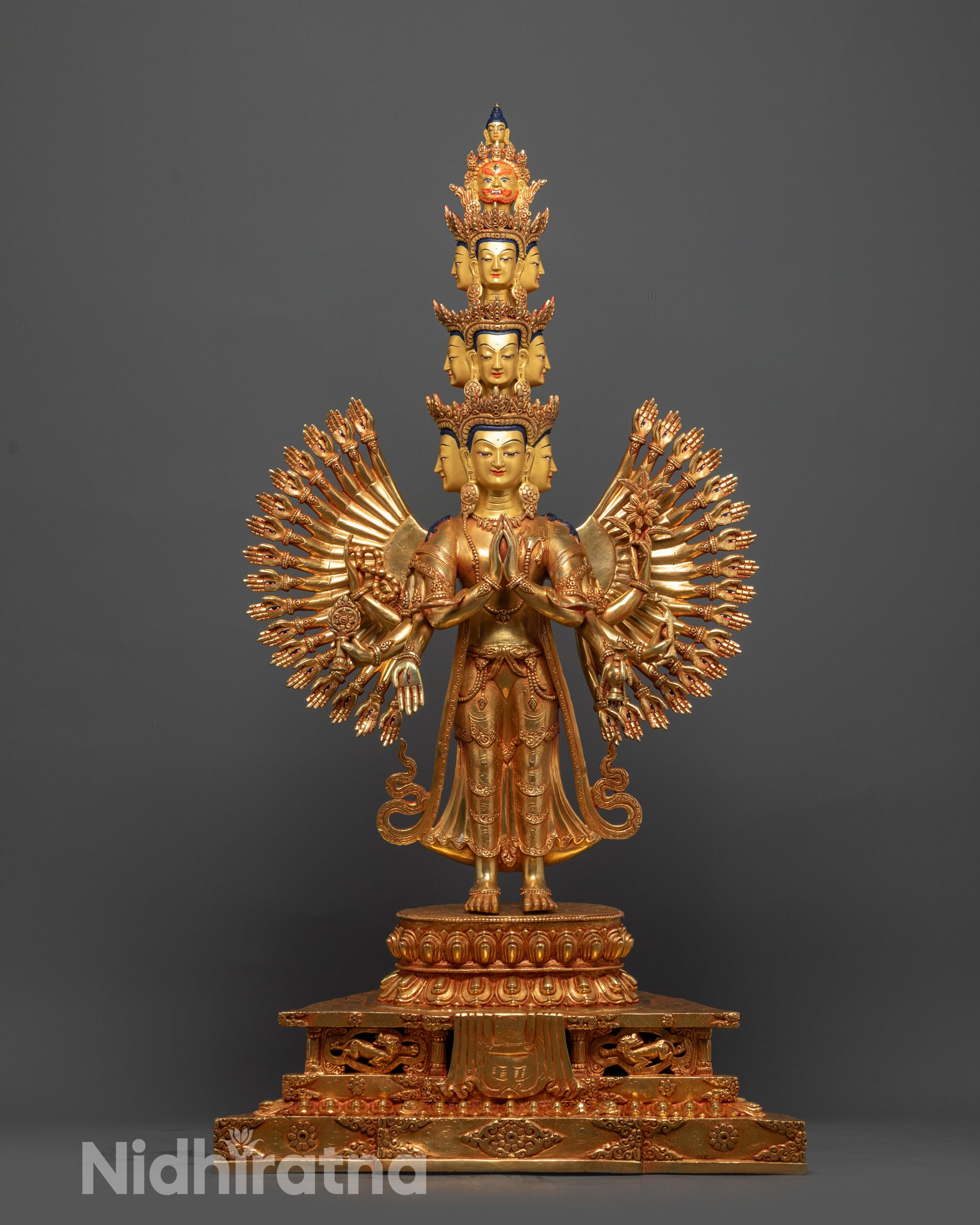 Side view of 1000-Armed Guan Yin Sculpture showing halo and lotus seat details
