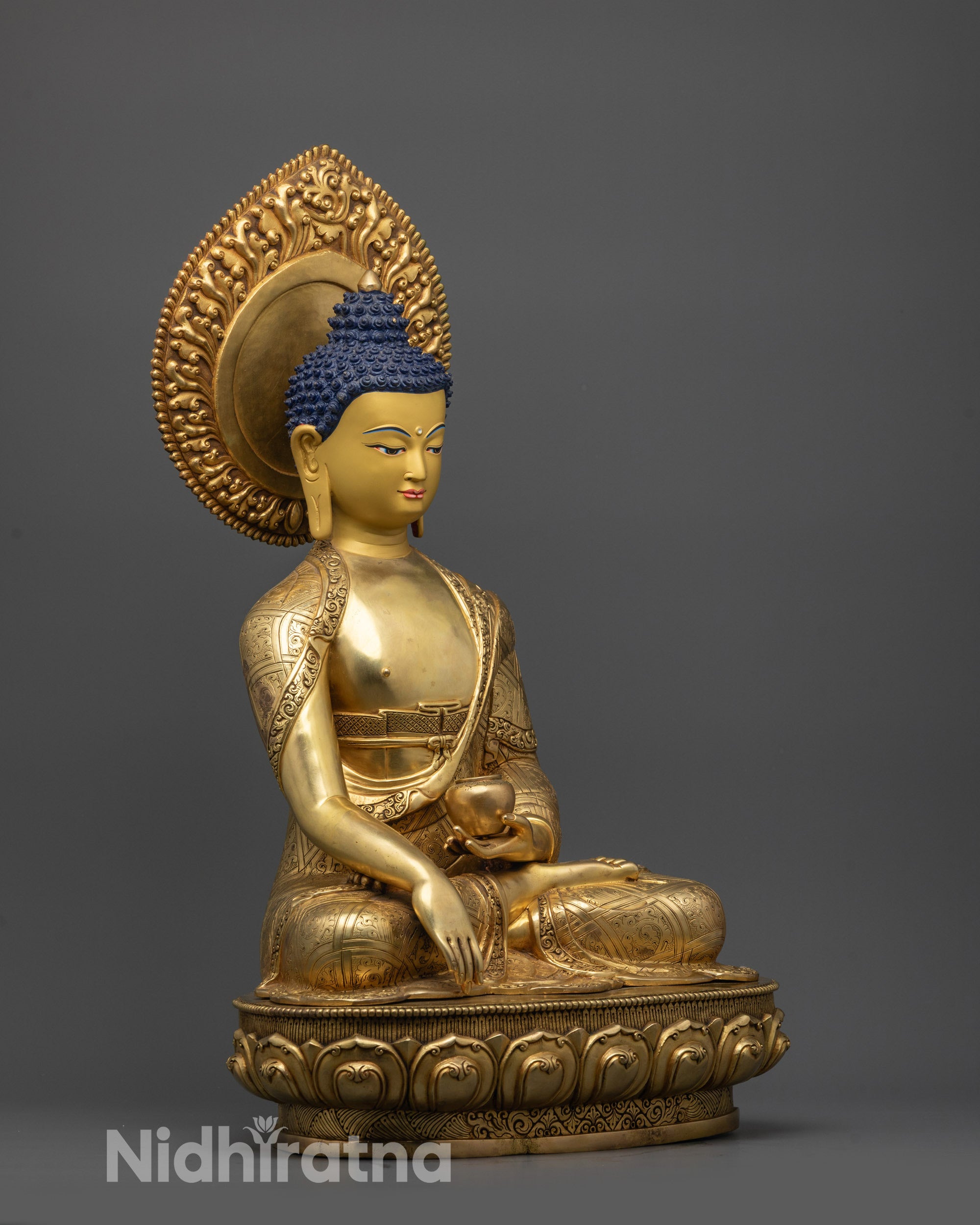 Side view of 24K gold fire-gilded Buddha holding Alms bowl on lotus seat