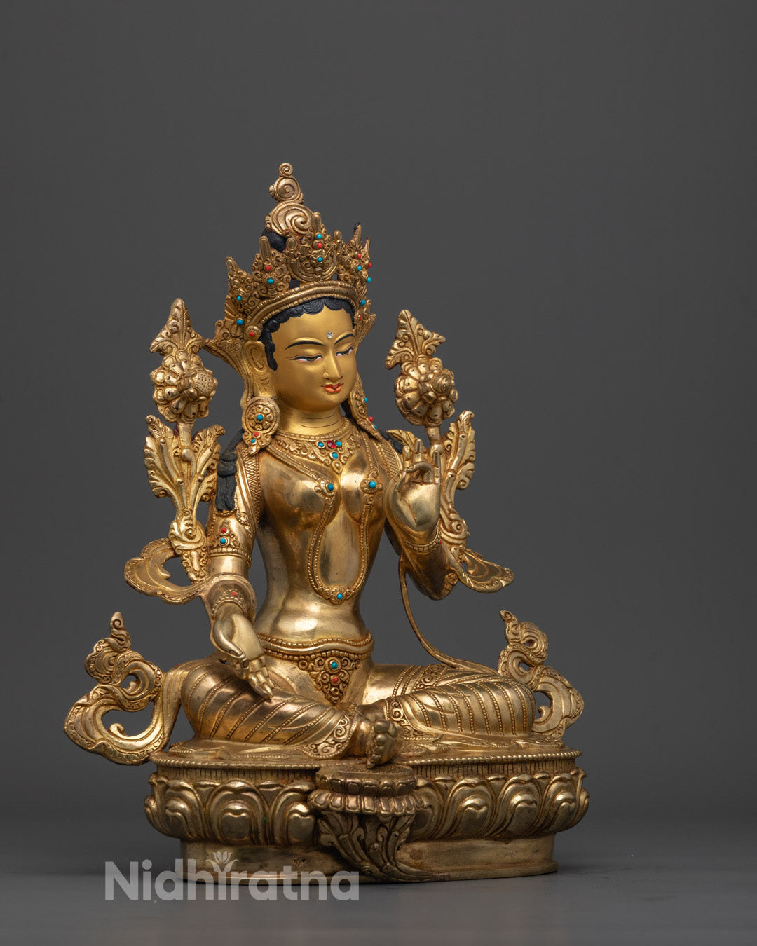 Side view of 24k gold-gilded Green Tara Statue with intricately designed lotus seat
