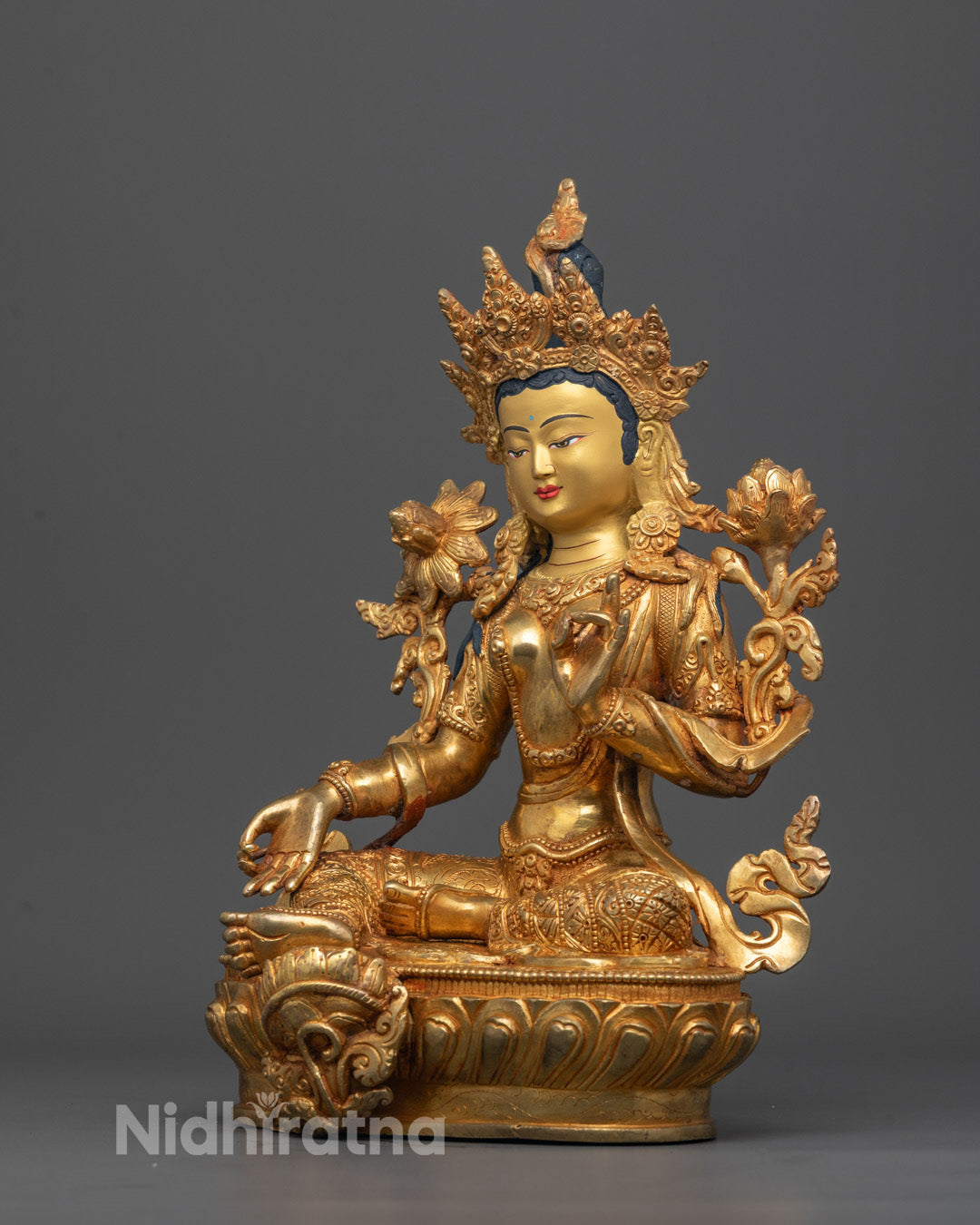 Side view of 24k gold-gilded Green Tara Statue with lotus seat