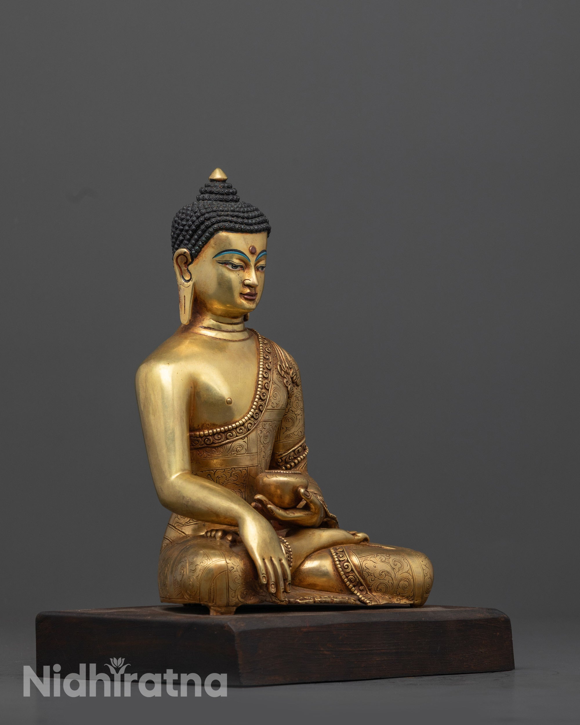 Side view of 24k gold-gilded Shakyamuni Buddha Statue on wooden lotus base, hand in Bhumisparsha