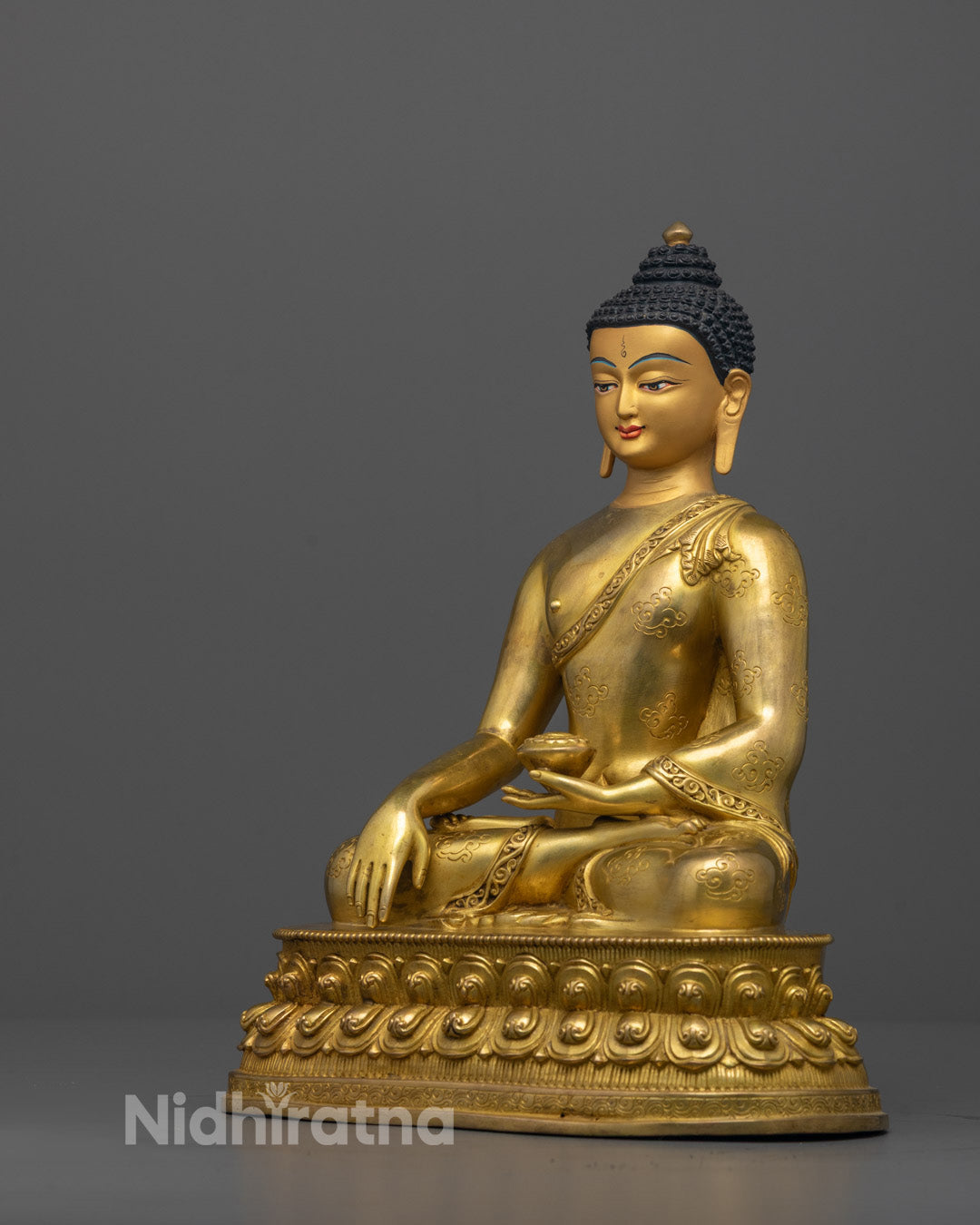 Side view of 24k gold-gilded Shakyamuni Buddha Statue showing lotus seat