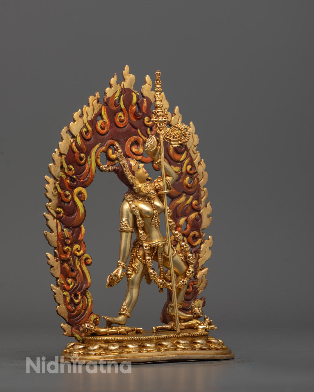 Side view of 24k gold gilded Vajrayogini Sculpture with ornate halo