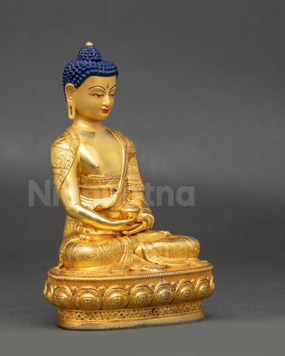 Side view of Amitabha Buddha statue highlighting lotus seat and monk's bowl symbolism