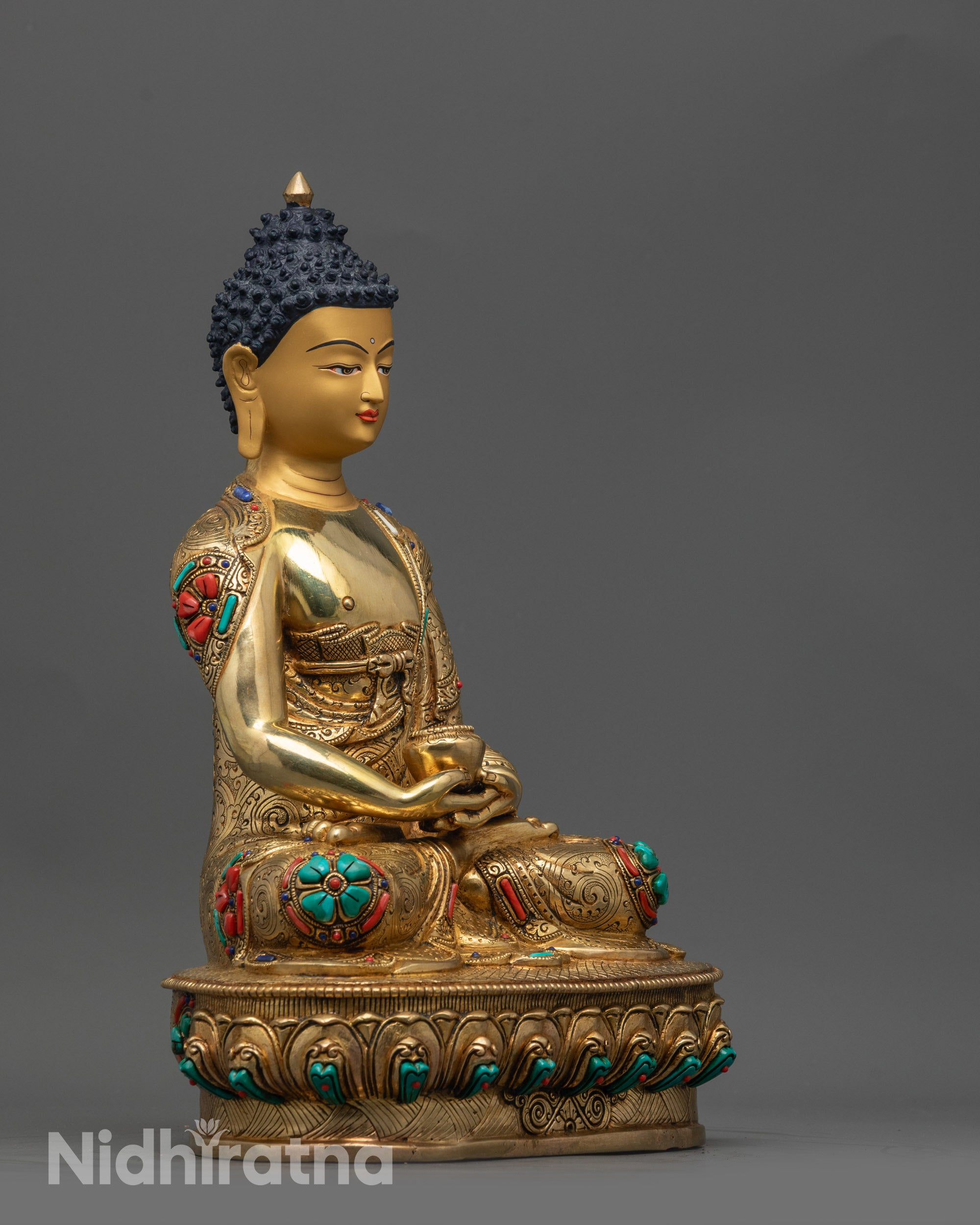 Side view of Amitabha Buddha statue holding monk's bowl in dhyana mudra on lotus seat