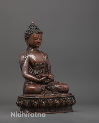 Side view of Amitabha Buddha statue with monk’s robe and intricately carved lotus base