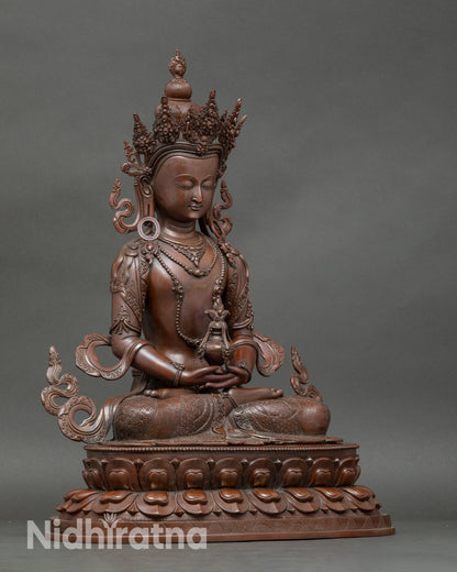 Side view of Amitayus Buddha holding medicinal vase, antique finish Nepalese sculpture