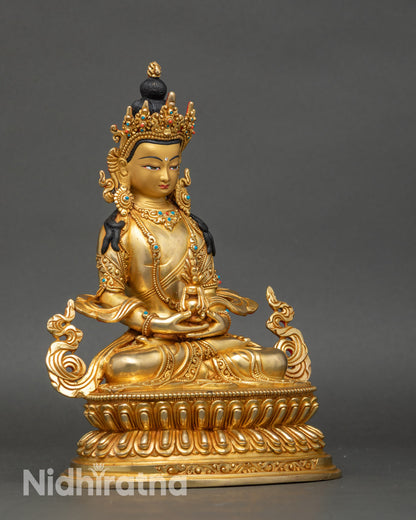 Side view of Amitayus Buddha sculpture with intricate lotus and gold accents