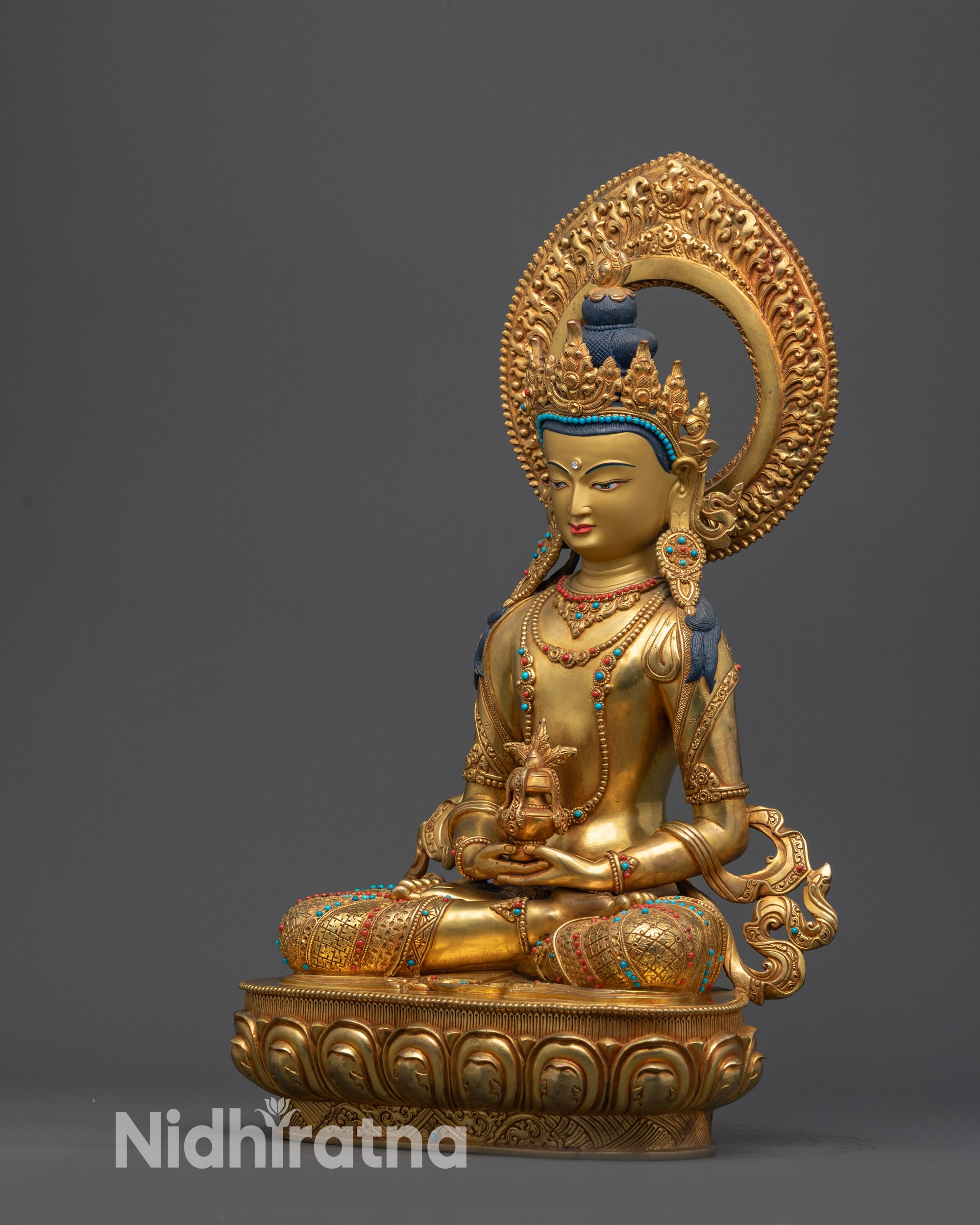 Side view of Amitayus Statue seated in meditative lotus position