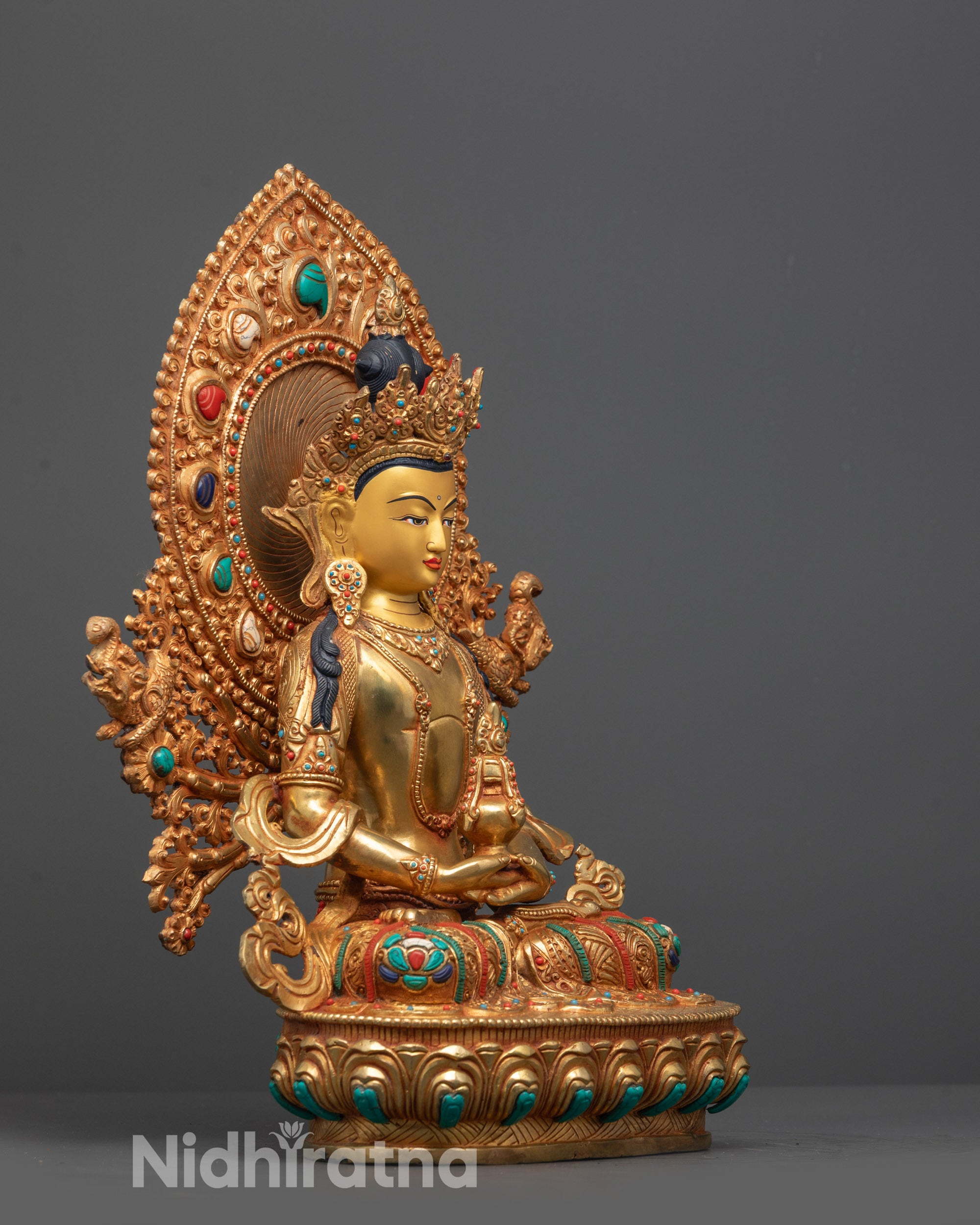 Side view of Amitayus Statue showcasing lotus seat, detailed robes, halo