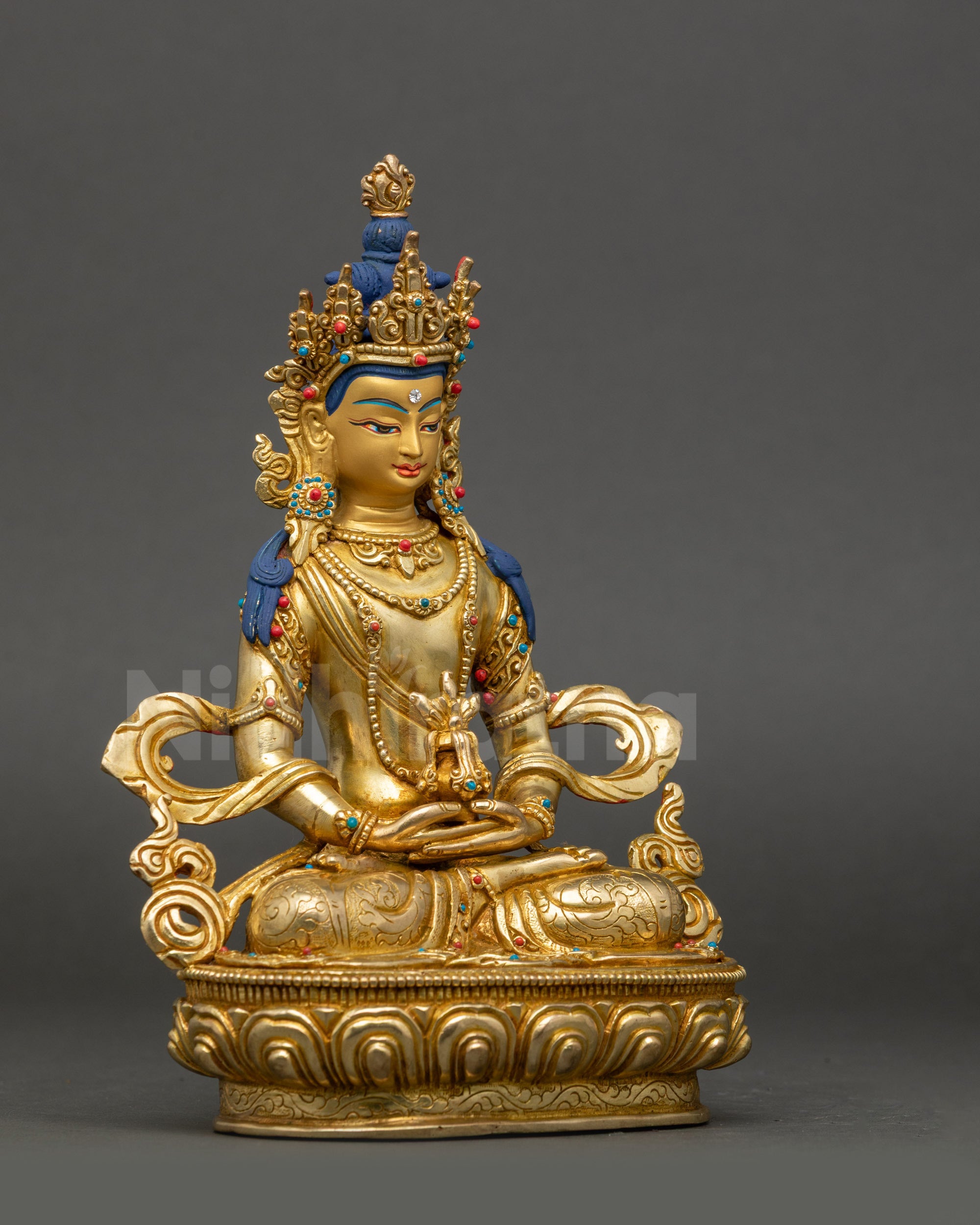 Side view of Amitayus longevity statue seated on lotus throne