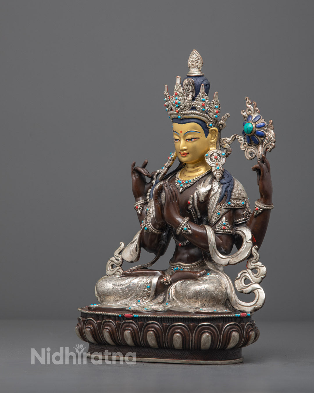 Avalokiteshvara statue handcrafted from oxidized copper, featuring intricate detailing, acrylic colors, and traditional Tibetan design.