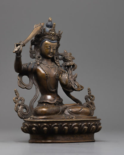 Side view of Beautiful oxidized copper Manjushri statue with intricate craftsmanship