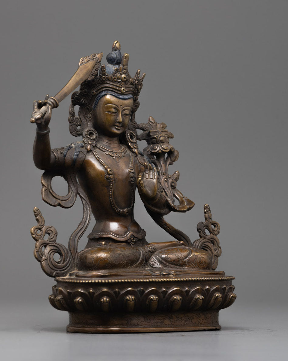Side view of Beautiful oxidized copper Manjushri statue with intricate craftsmanship