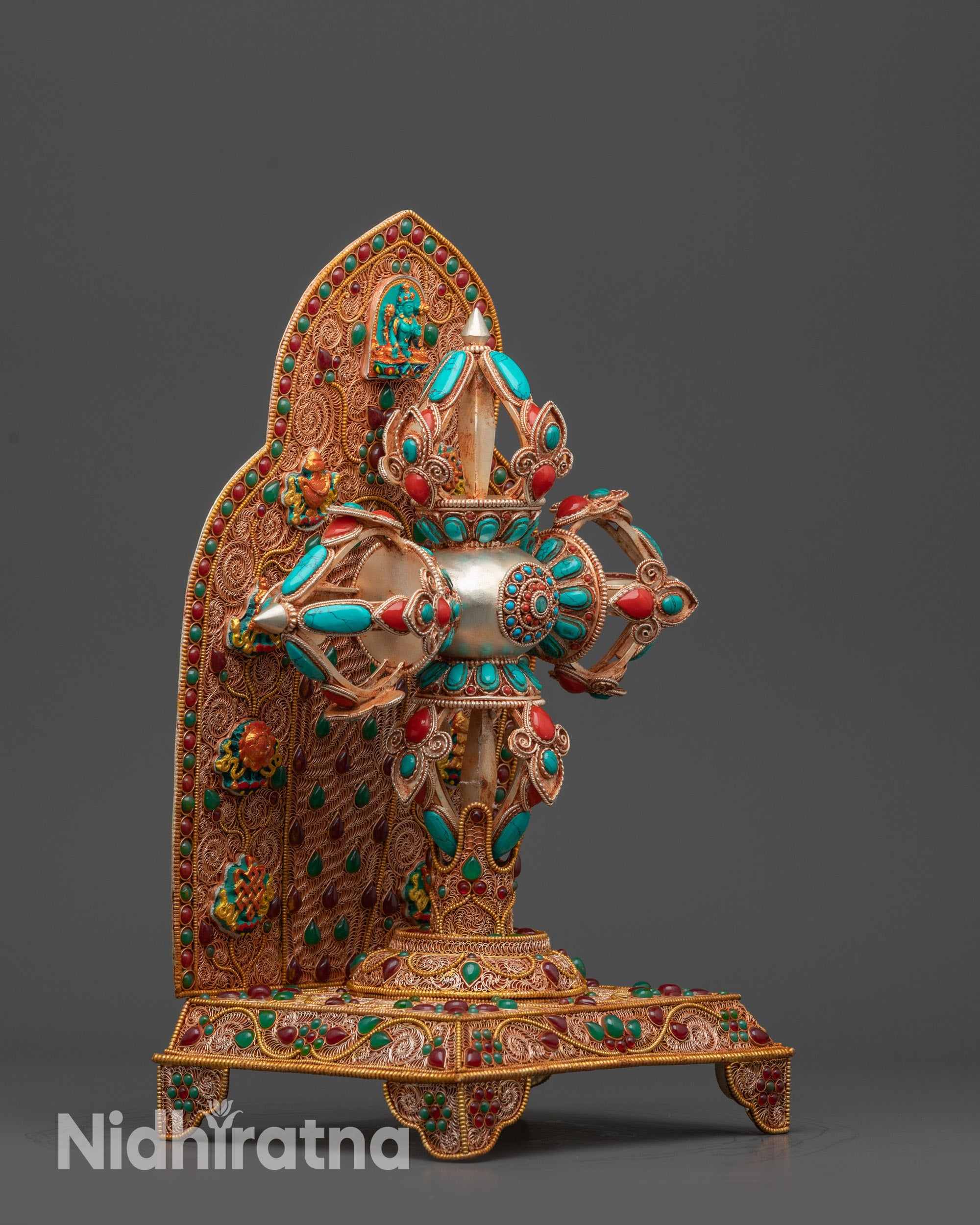 Side view of Bishwo Vajra highlighting turquoise and coral semi-precious stones