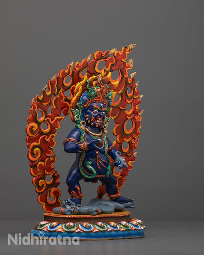 Side view of Black Dzambhala Statue Standing on Human Figure atop Lotus Base