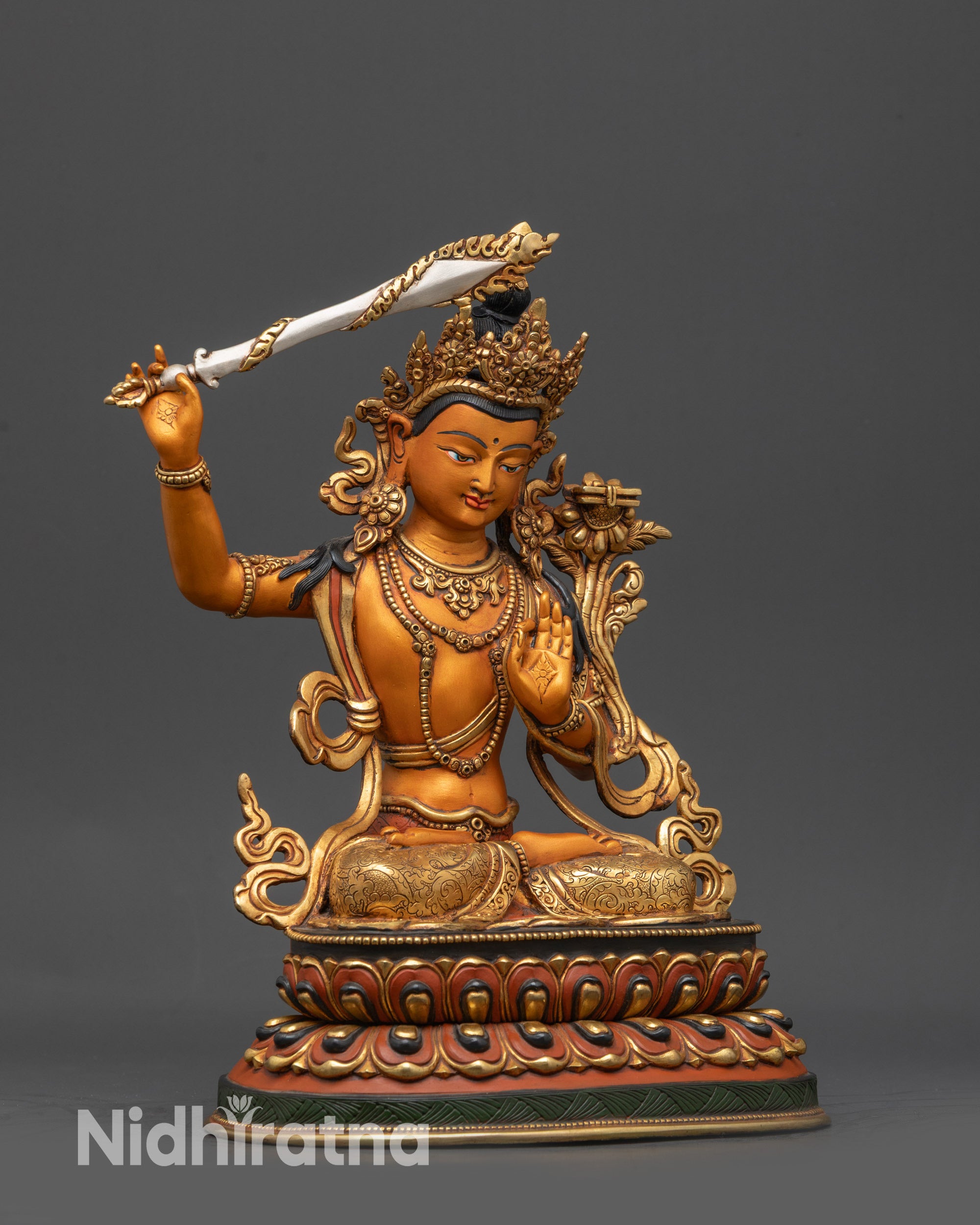 Side view of Bodhisattva Manjushri Statue with swirling robe and lotus seat carvings
