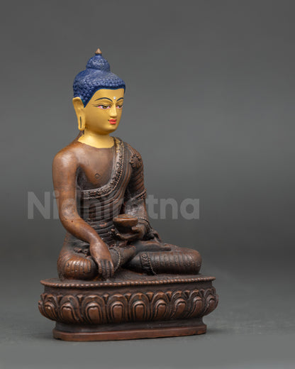 Side view of Buddha Shakyamuni statue highlighting lotus seat and begging bowl